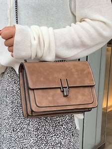 British retro brown crossbody bag with metal chain and vintage textured leather