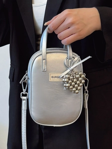 Minimalist metallic silver crossbody phone bag with beaded heart pendant and top handle