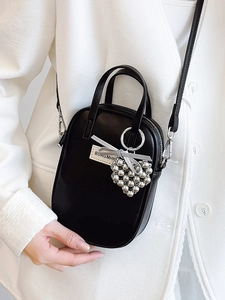 Minimalist black leather crossbody phone bag with heart charm and silver bead detail