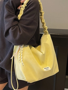 Minimalist bright yellow large capacity tote bag with ruched strap for commuting