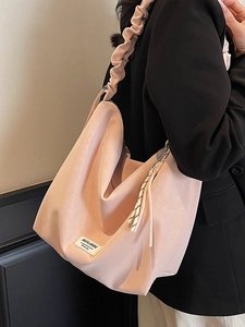 Pink minimalist hobo tote bag with pleated shoulder strap and large capacity for daily use