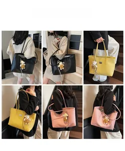 Detailed views of leather tote bags with lychee pattern and cute bear charms in multiple colors