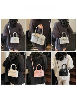 Mini shell bags in four colors shown with short handles and adjustable straps
