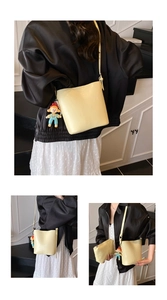 Minimalist light yellow bucket bag set with cute doll pendant and matching inner pouch