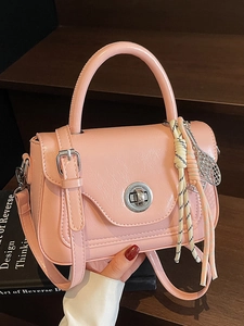 Pink vintage oil wax leather crossbody handbag with tennis racket charm decoration