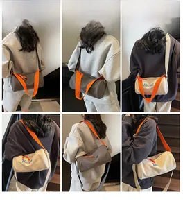 Detail of Boston bag with 1985 print and orange shoulder strap for fitness
