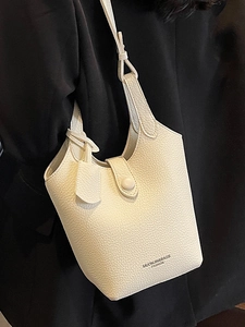 Chic beige lychee pattern leather bucket bag for women with Muonjin Bags logo detail