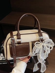 Chic cream and dark brown contrast Boston bag with pearl bow and shoulder strap