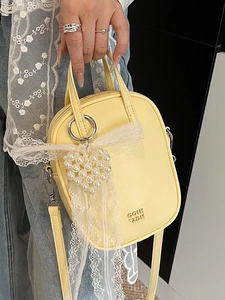 Borsa a tracolla giallo chiaro per cellulare con fiocco di pizzo e ciondolo a cuore