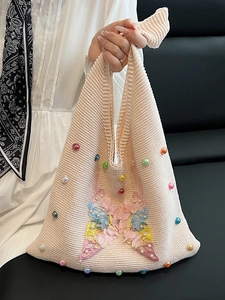 Pink crochet shoulder bag with colorful 3D butterflies and beaded floral accents