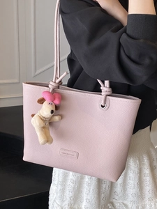 Minimalist light pink pebble leather tote bag for women with cute puppy plush keychain