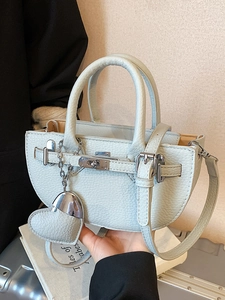 Fashionable light blue lychee pattern half-moon handbag with heart charm for women