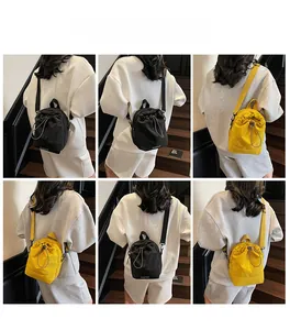 Detailed views of nylon drawstring crossbody bags in black and yellow colors