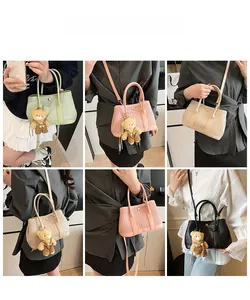 Detailed views of woven tote bags in multiple colors with cute teddy bear pendants