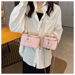 Detailed comparison of pink quilted leather box bags in small and large sizes with chain straps