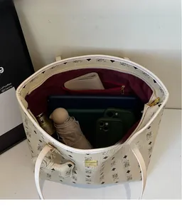 Top view showing the large interior storage of this printed tote bag with inner pocket