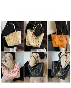 Detail view of large tote bags with classic pattern prints in four colors with bear charm