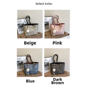 Four color options of textured tote bags in beige, pink, blue, and dark tea with fur pom charms