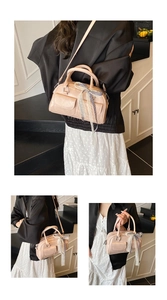 Close-up of pink bow hobo bag with lace and checkered ribbon detail for women