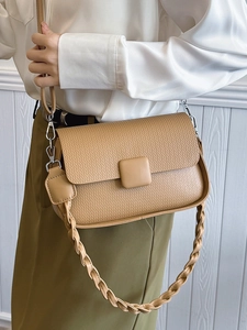 Minimalist camel crossbody bag with woven texture and braided handle for women