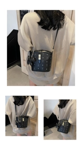 Classic bucket bag with vintage monogram pattern and plush bear charm worn by a model