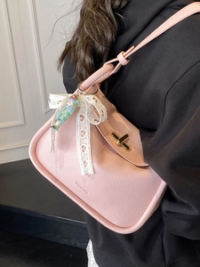 Pink lychee texture leather shoulder bag with golden buckle and lace bow decoration