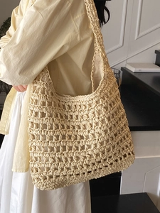 Minimalist beige hollow crochet straw tote bag for summer beach vacations and daily use