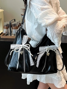 Balletcore style black glossy tote bag with white lace bows and pearl charms for women