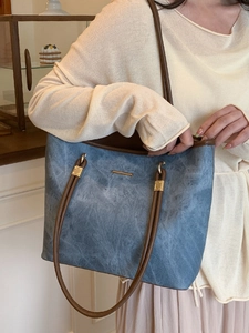 Minimalist large capacity tote bag in blue-grey faux denim with brown shoulder straps