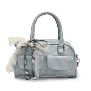 Light blue faux leather bow bowling bag with dual front pockets and lace ribbon detail
