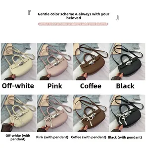 Detail view of lychee pattern bucket bags with metal locks and pearl bow charms