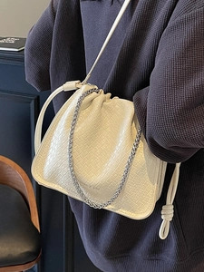 Fashionable off-white woven texture bucket bag with silver chain and leather strap