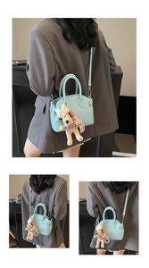 Detail of light blue lychee pattern shell bag with cute plush dog pendant charm