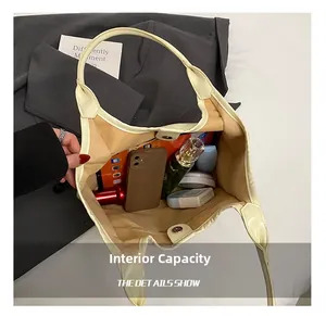 Interior view showing large capacity for essentials with magnetic closure for the tote bag