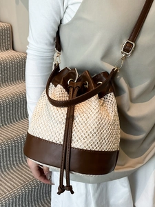Contrast stitching straw bucket bag with brown leather trim and drawstring for women