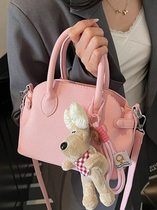 Pink lychee grain leather shell handbag with cute Gromit dog charm for daily commute