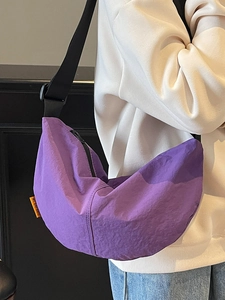 Versatile purple crescent-shaped crossbody dumpling bag with wide adjustable shoulder strap