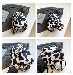 Detailed four-way view of a cow print mini backpack showing front and back design