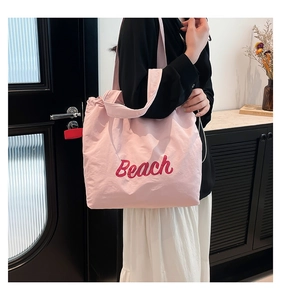 Pink casual tote bag with red Beach lettering and large capacity for daily use