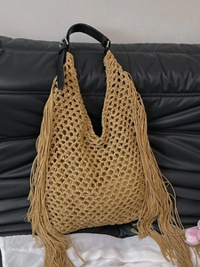 Bohemian hollow woven tote bag with long tassels and black leather shoulder strap