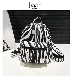 Detail showing zebra print texture on large capacity backpack with front pocket