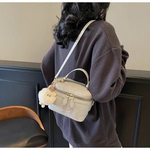 Fashion box bag in light grey leather with a cute sheep plush charm and top handle
