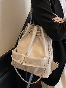 Chic beige oil wax leather backpack with silver studs and chain straps for women
