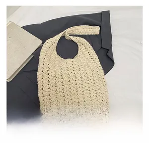 Close-up of beige crochet tote bag showing wave-pattern openwork knit detail