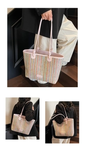 Detail of colorful woven straw tote with pink leather handles and knot design details