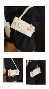 Detail of off-white leather shoulder bag with star charm and decorative buckles
