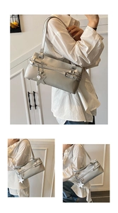 Detailed macro view of silver crossbody bag with star charms and buckle accents