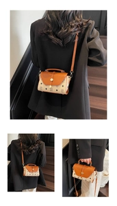 Detail of vintage printed crossbody bag with leather flap and metallic lock closure