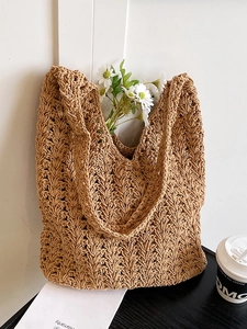 Minimalist tan crochet woven tote bag for summer beach vacations with wave pattern