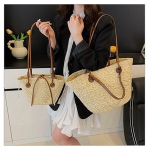 Detailed comparison of two sizes of straw woven tote bags with leather straps and drawstring